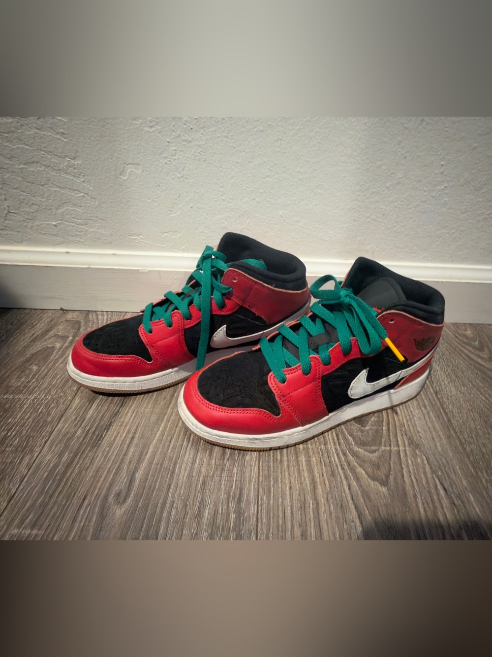 Nike Kids Jordan’s Red and Black High-Top Sneakers with Green Laces